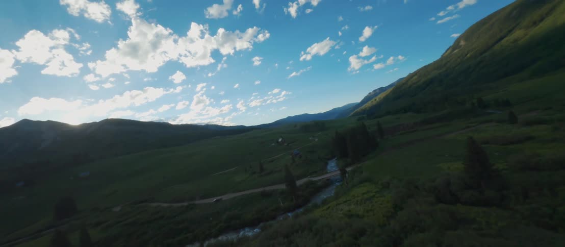 An aerial view of a mountain valley on a summer day