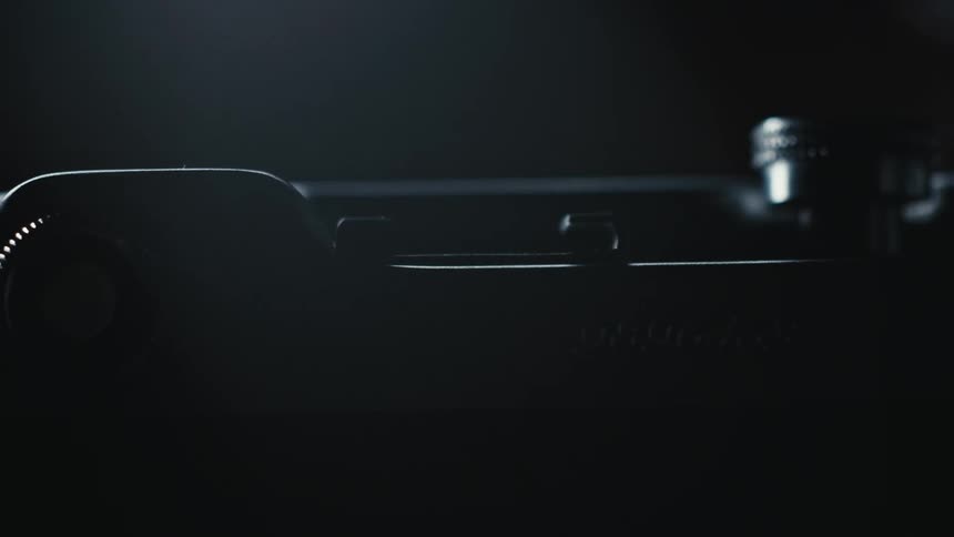 Silver and black machine has several dials and buttons