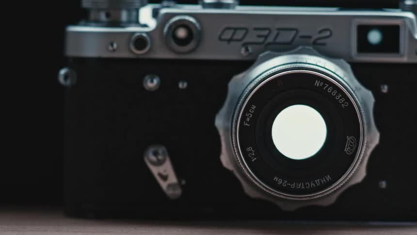 A camera lens aperture opens