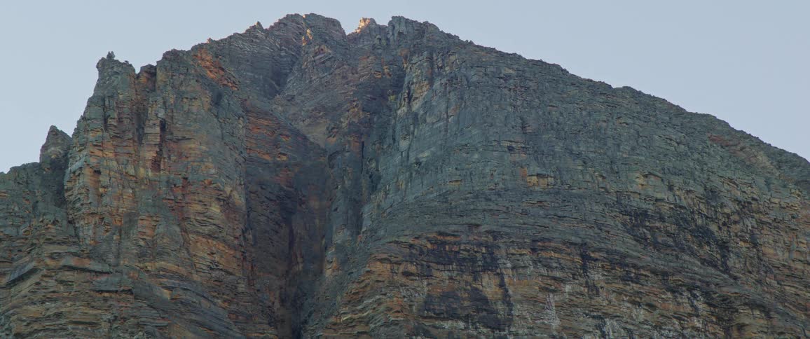 Tall cliffs against blue sky