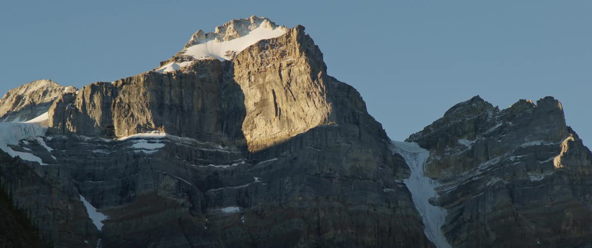 An aerial view of a mountain is displayed