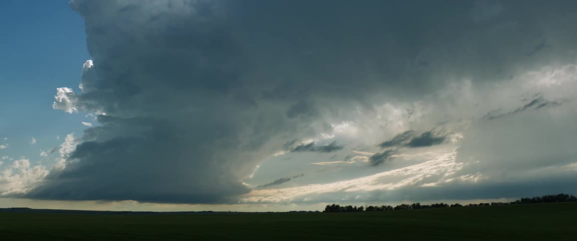 Dark storm clouds over a grassland