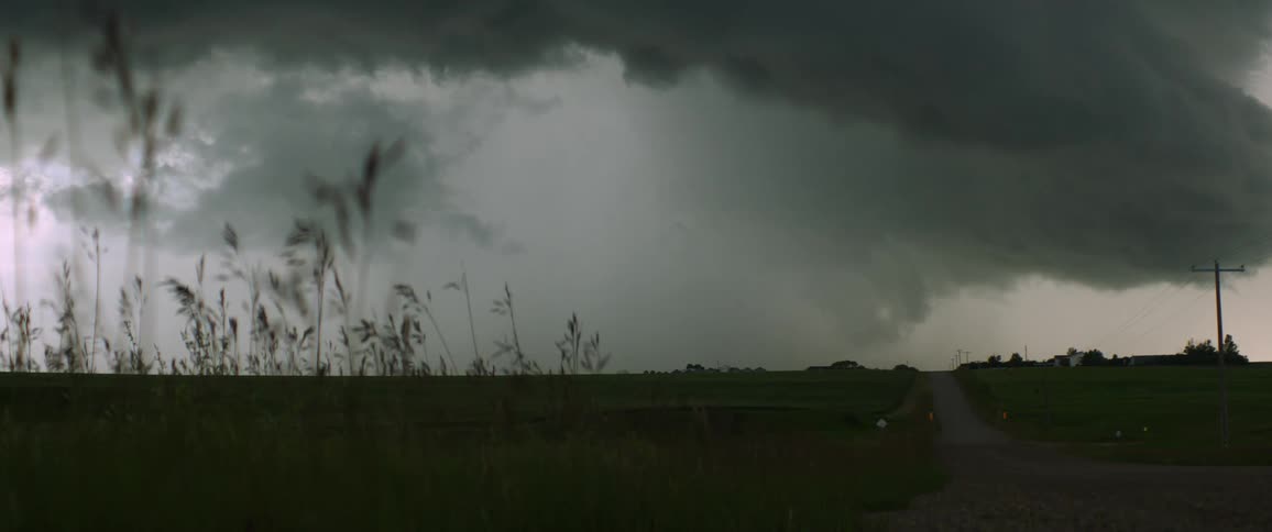 Storm clouds over a field on a farm