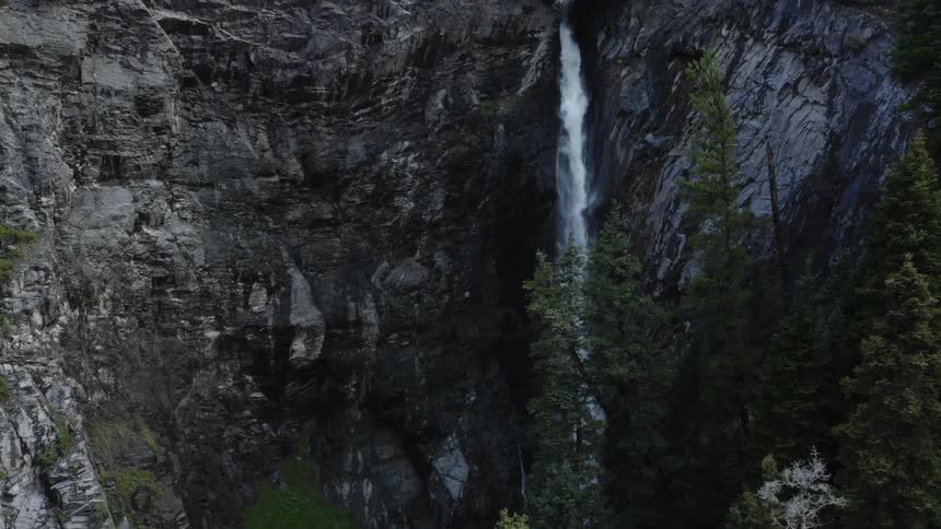 Aerial view of a waterfall crashing over a cliff