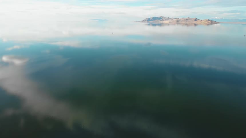 Blue skies reflect off clear ocean water