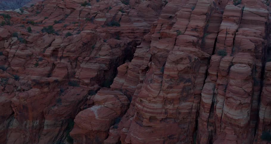 A ravine in a mountain of red stone on a sunny day