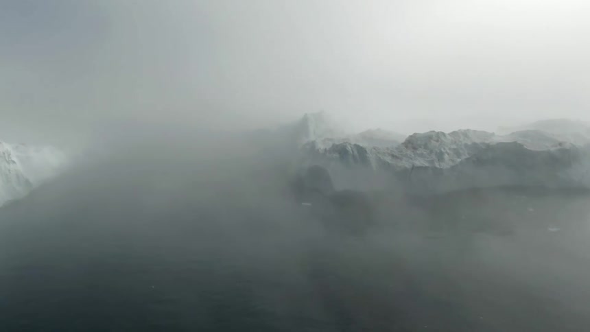 Mountain tops peek out through heavy fog