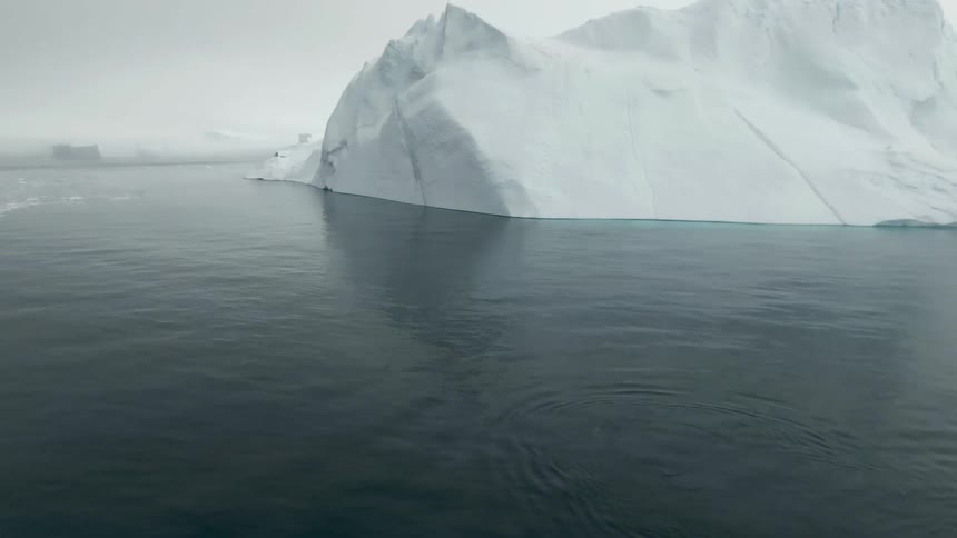 Ocean waters move slowly around a large polar ice cap