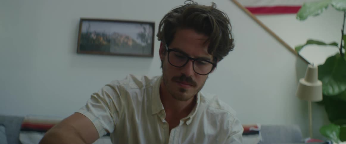 A man flips through a book and looks focused