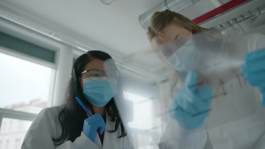 A doctor and a nurse look at results together