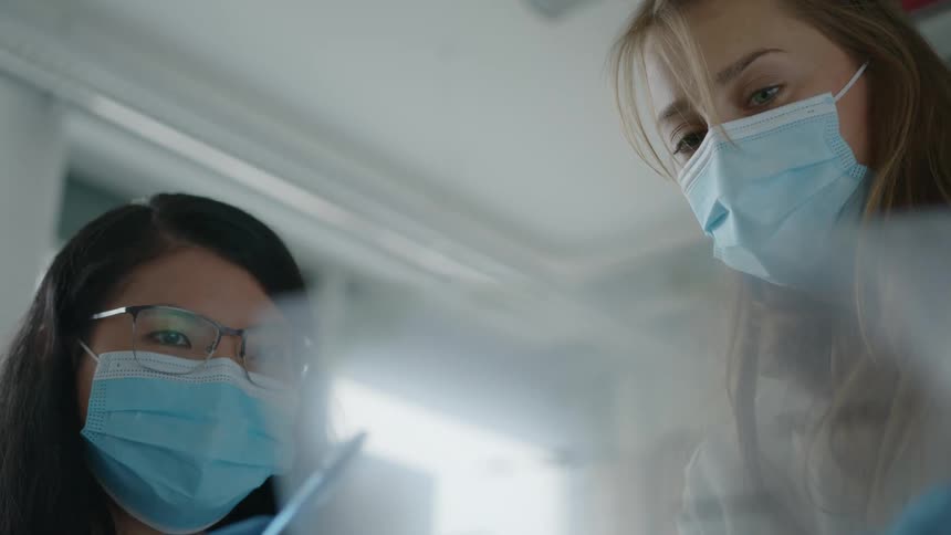 Two women look at medical results
