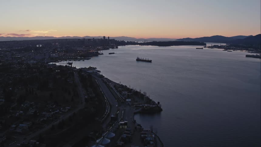 Downtown Vancouver aerial at dusk with harbour