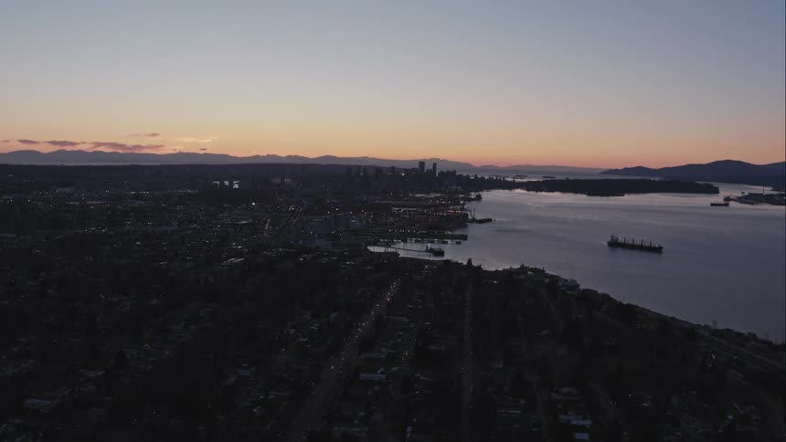 Aerial view of Vancouver city skyline at sunset