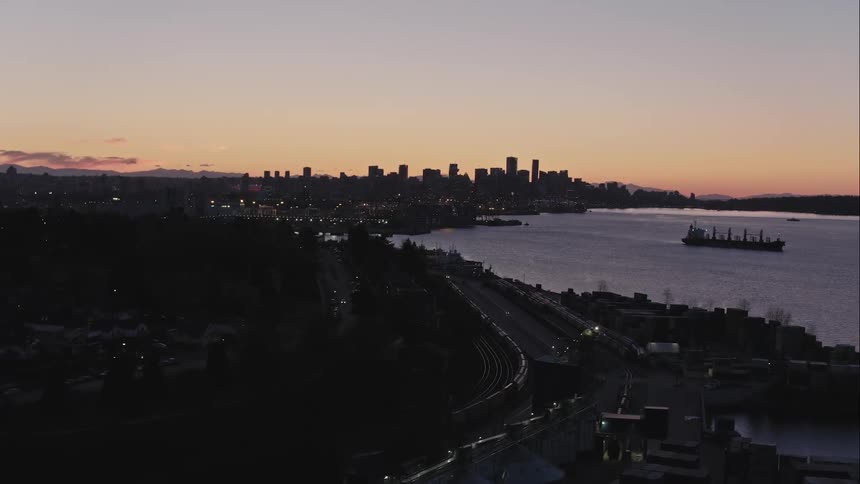 Aerial view of Vancouver City skyline and harbour at sunset