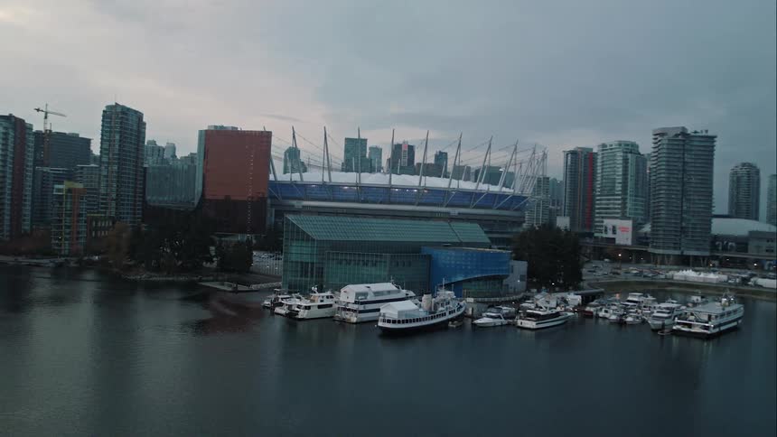 Vancouver's False Creek on display with boats and stadium downtown