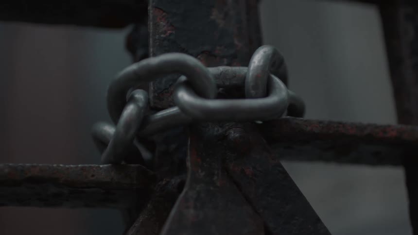 A chain wrapped around a metal gate