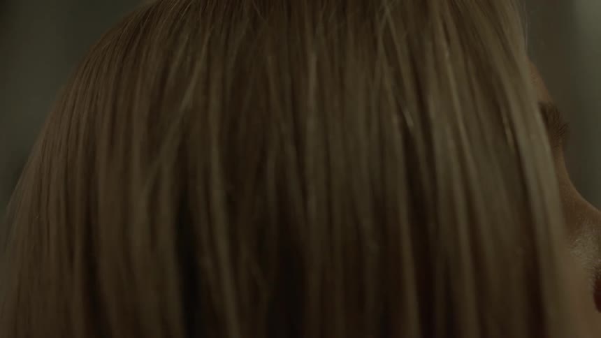 A woman with eyes looking upward