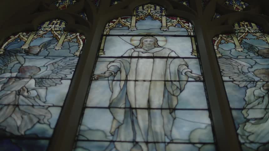 Stained glass church windows featuring jesus