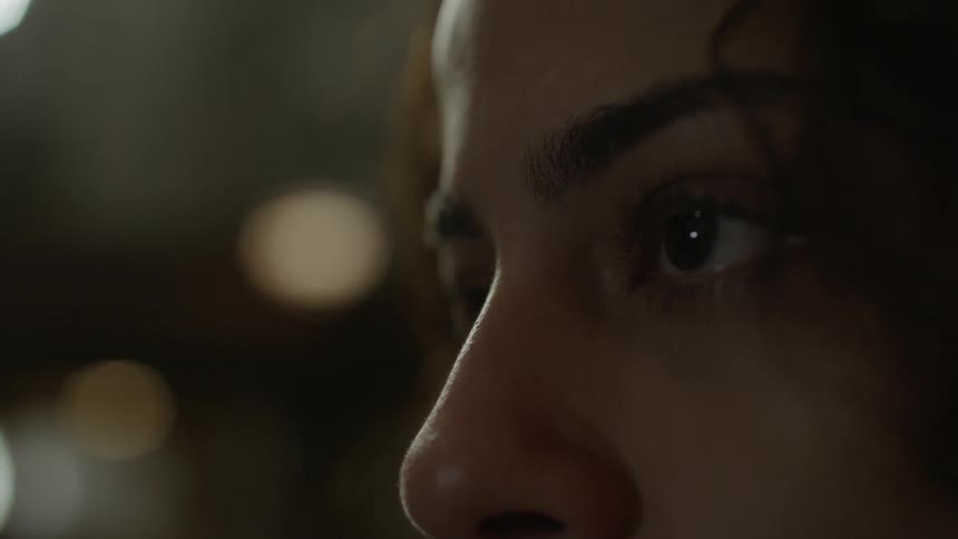 The open eyes of a woman looking forward