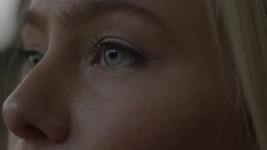 A woman's eyes as she is looking thoughtfully at something off camera