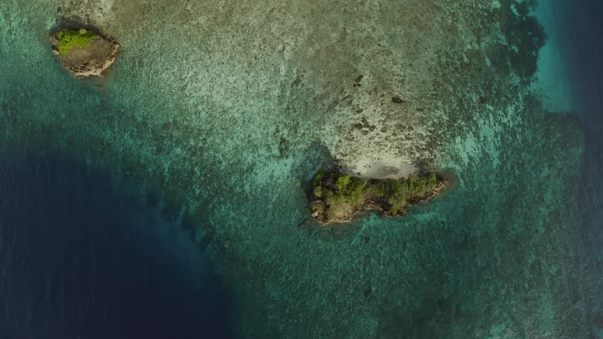 Islands surrounded by blue and turquoise ocean water