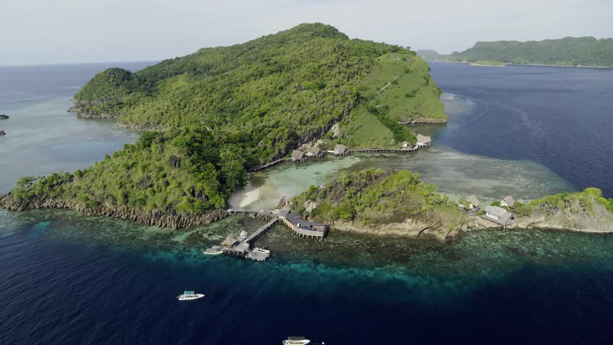 Aerial view of boats in the bay of the tropical island