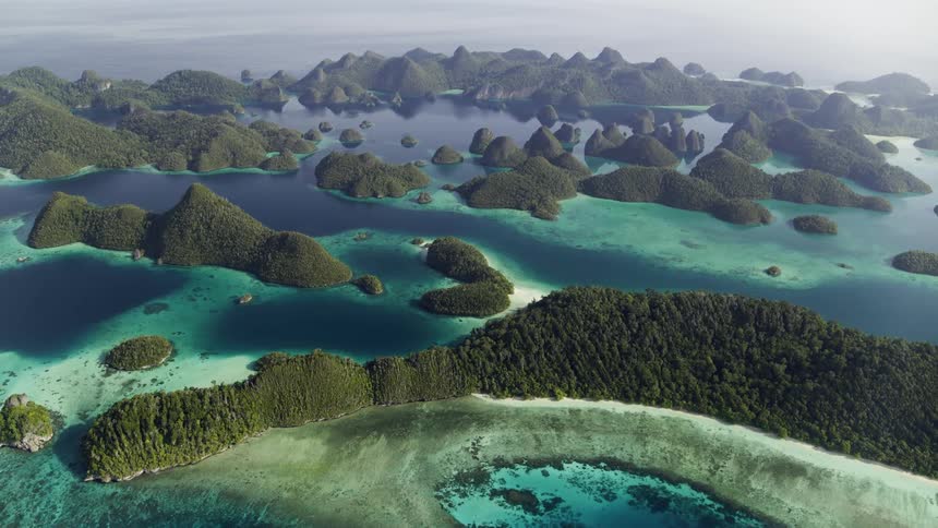 Tropical islands surrounded by blue and turquoise ocean water