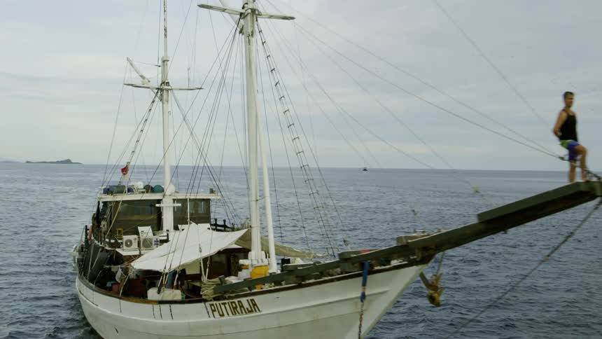 Man standing at the front of his boat