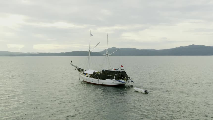 A ship is driving on the ocean water