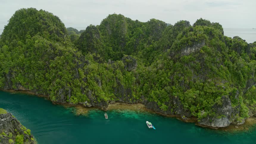 Aerial view boats in the bay of the tropical island