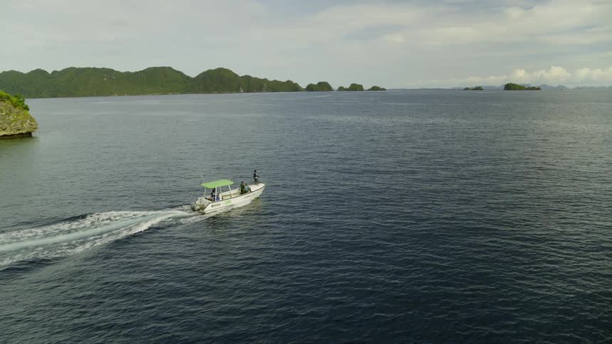 People on a boat sailing in the ocean
