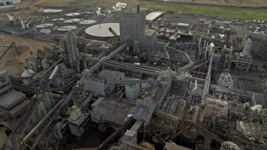 Flying over a vast and complex industrial facility