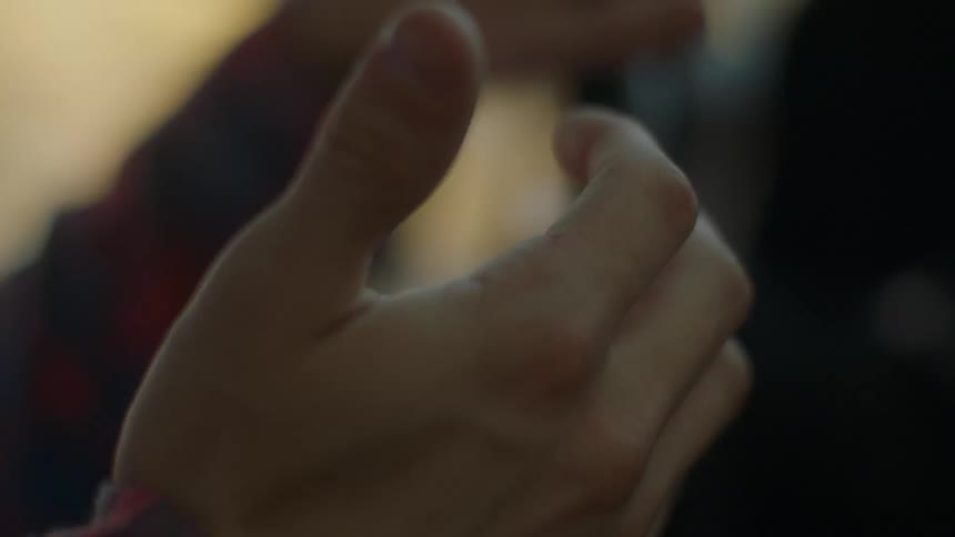 Hand twiddling fingers in a moving vehicle