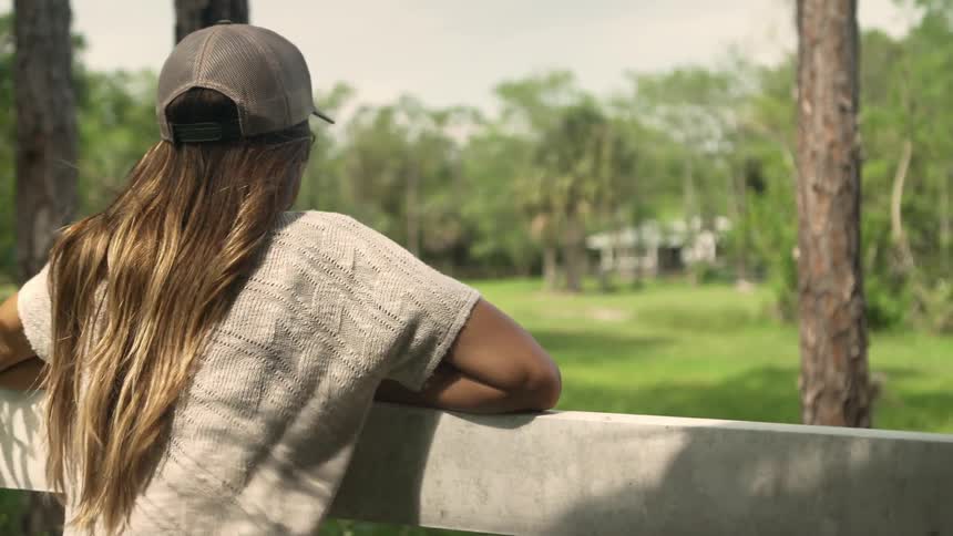 A woman is outdoors in spring