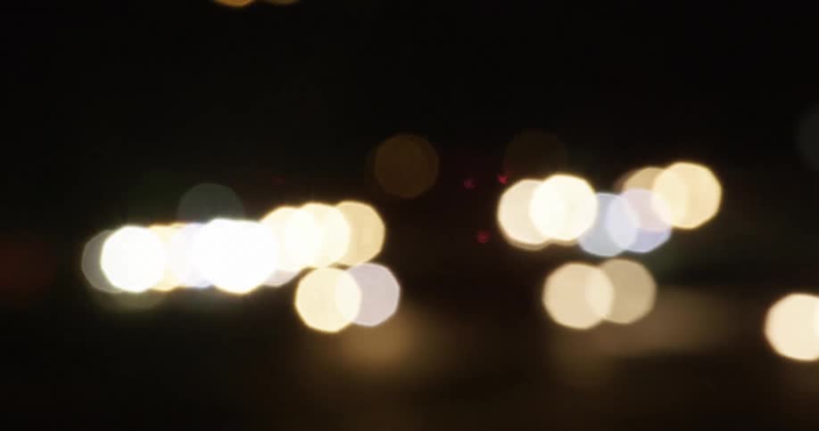Lights flying across a dark background