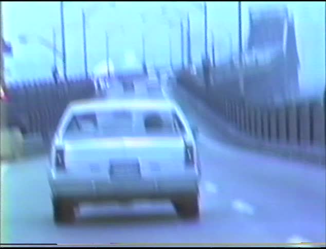 Vehicles are traveling over the bridge