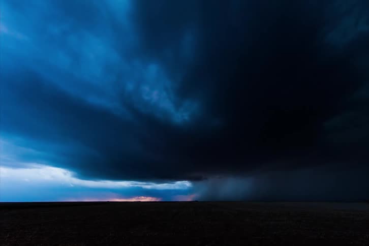 A storm is forming in the sky with lightning