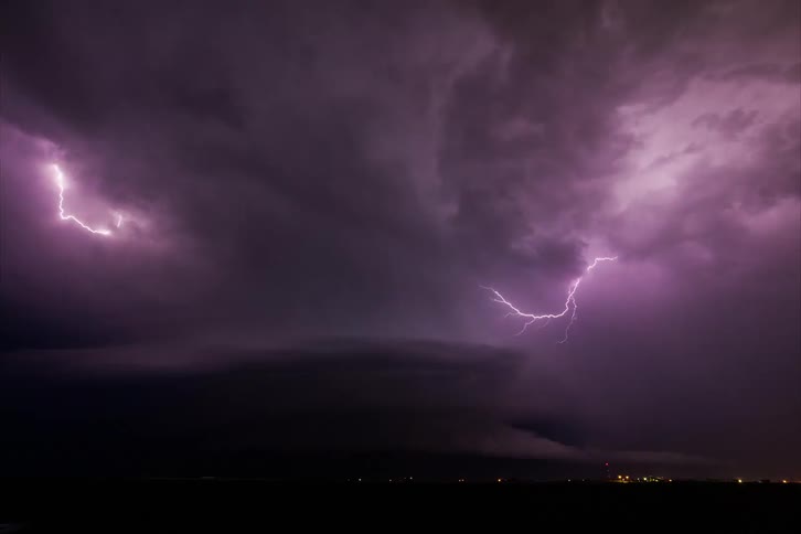 Aerial view of night sky with lightning and storms
