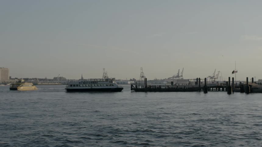 Boats move in a harbor