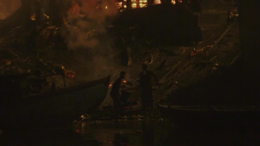 The homes near the shore are on fire
