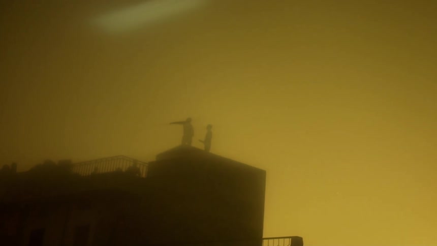 People are standing on the roof in a smoke filled area