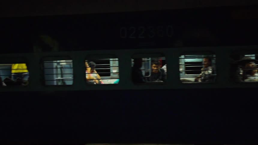 A commuter train is packed at night