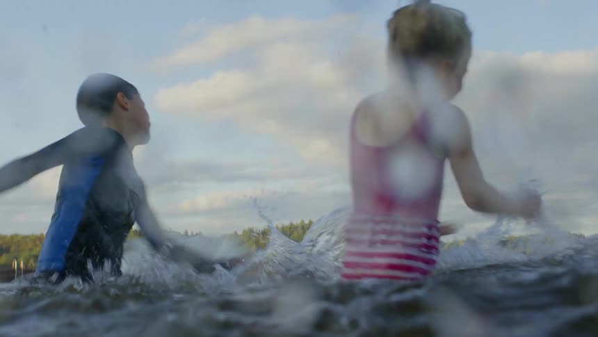 Four children play in the water