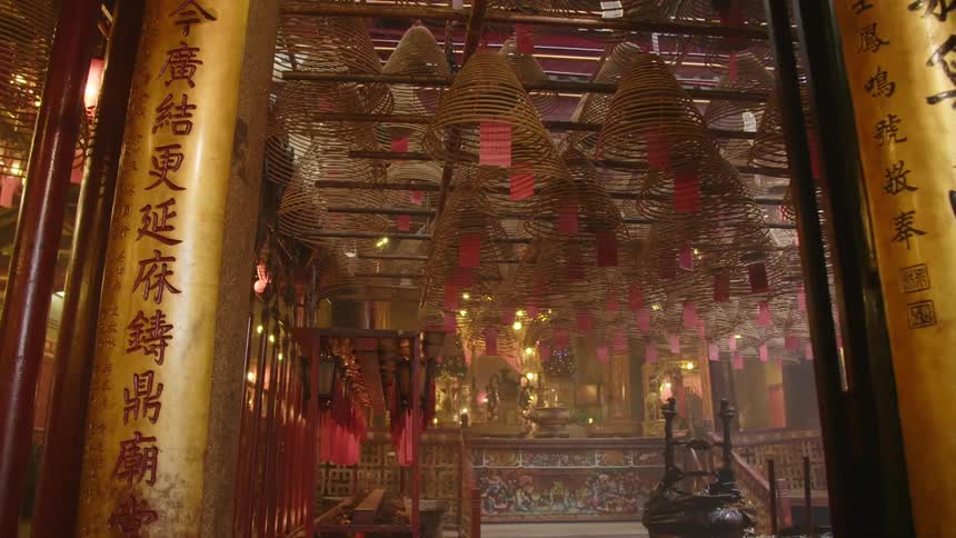 Interior os asian temple with red black and gold with text and columns