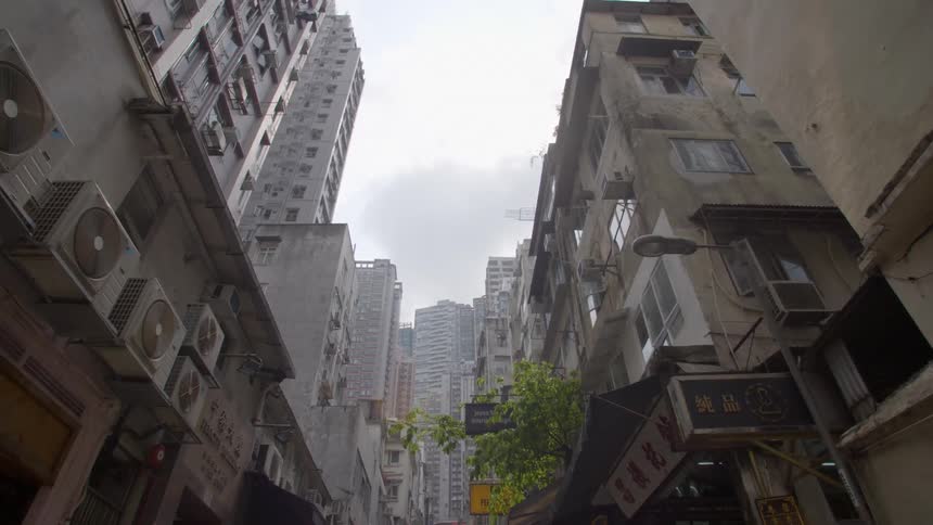 A city block is filled with tall apartment buildings and skyscraper office buildings