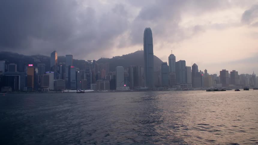 Boats on the water in front of the city skyline