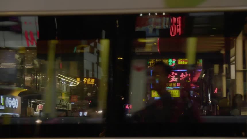 A busy downtown area with a lot of people in an asian area