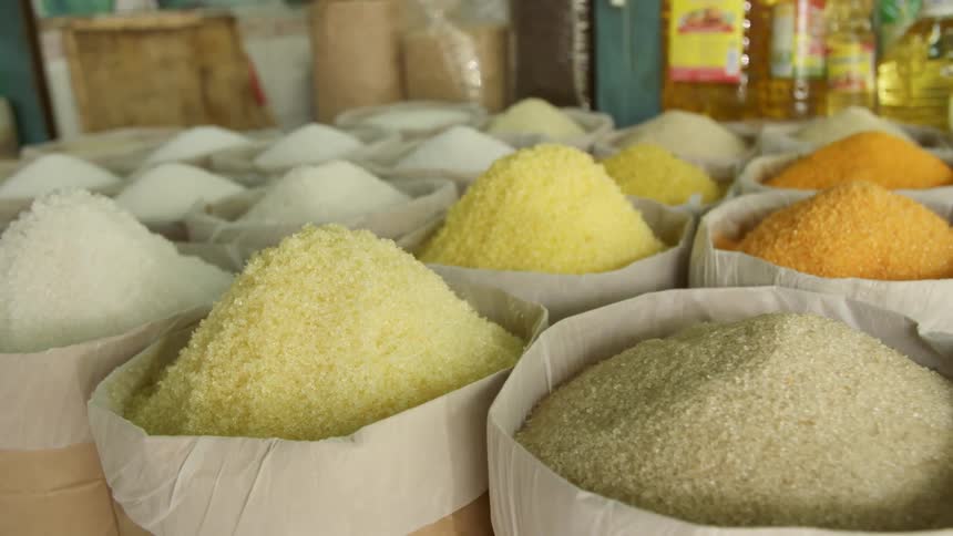 Bags of grain are displayed at a market