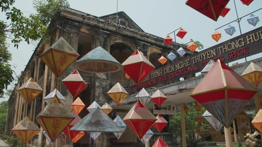 Paper lanterns hanging outside in front of an ancient building