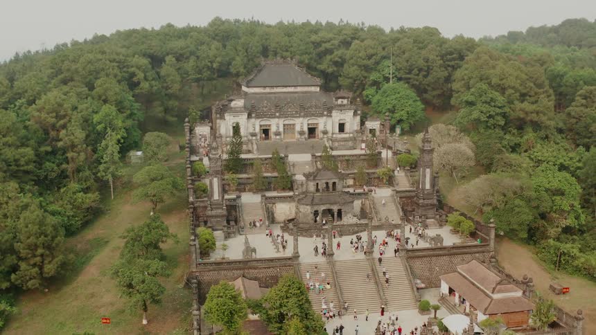 Hundreds of visitors tour a castle in the countryside